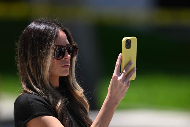 <p>Margo Martin, deputy director of communications for Donald Trump, looks at a phone outside the Wilkie D. Ferguson Jr. United States Federal Courthouse in Miami, Florida, on June 13, 2023.</p>
