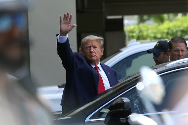 <p>Donald Trump waves to supporters outside of a Miami courtroom where he was arraigned on federal charges </p>