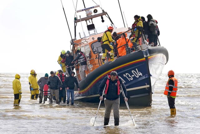 A group of people thought to be migrants are brought in to Dungeness, Kent, from the RNLI Dungeness Lifeboat, following a small boat incident in the Channel (Gareth Fuller/PA)