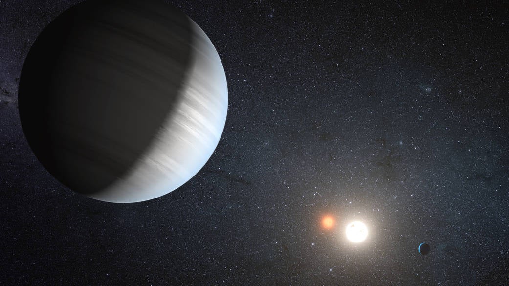 Artist’s concept illustrates Kepler-47, the first transiting circumbinary system that was discovered