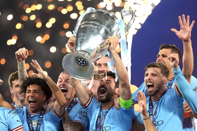 Manchester City’s Ilkay Gundogan lifts the Champions League trophy (Martin Rickett/PA)