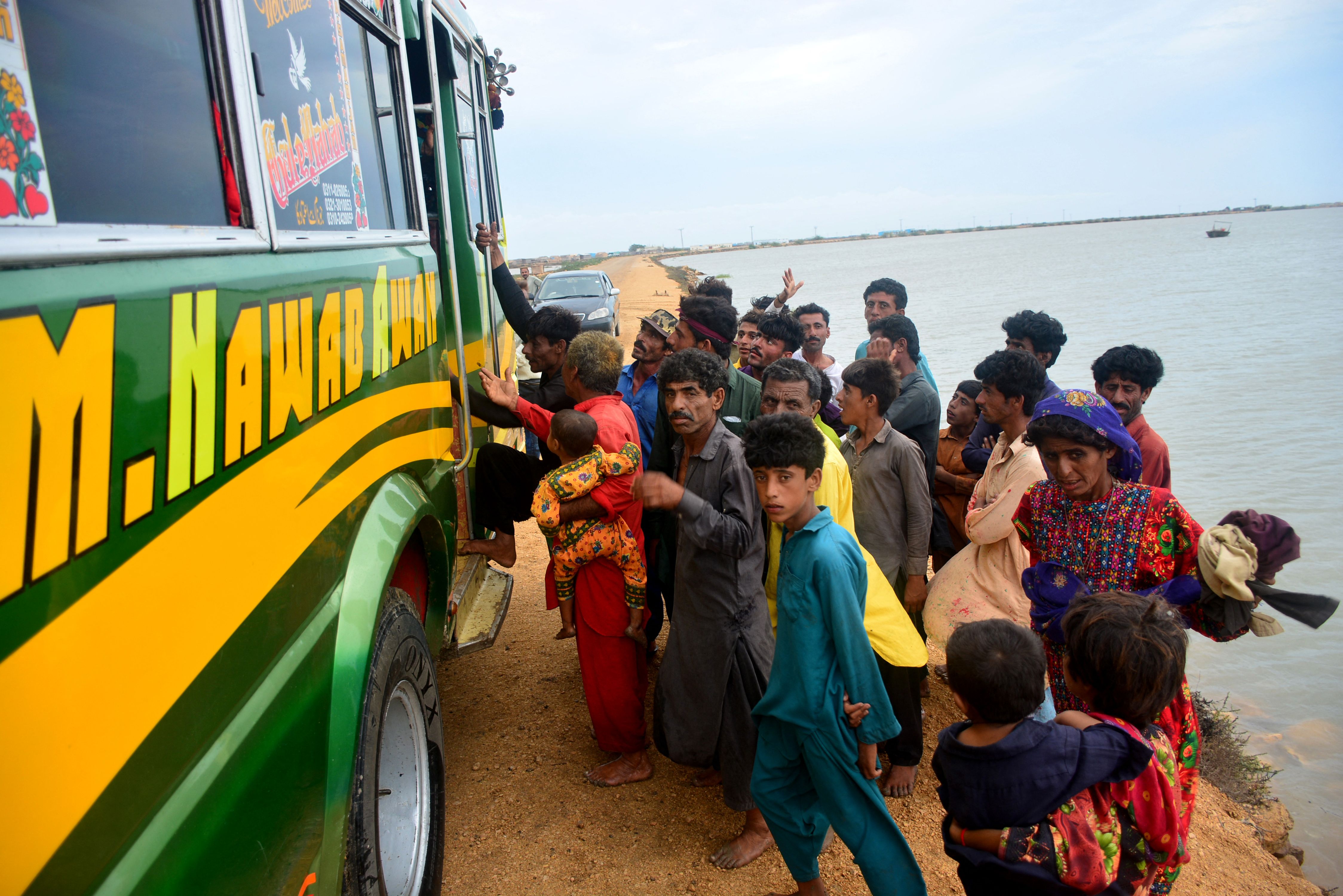 Residents evacuate from a coastal area of Keti Bandar before the due onset of cyclone Biparjoy, in Thatta district of Pakistan’s Sindh