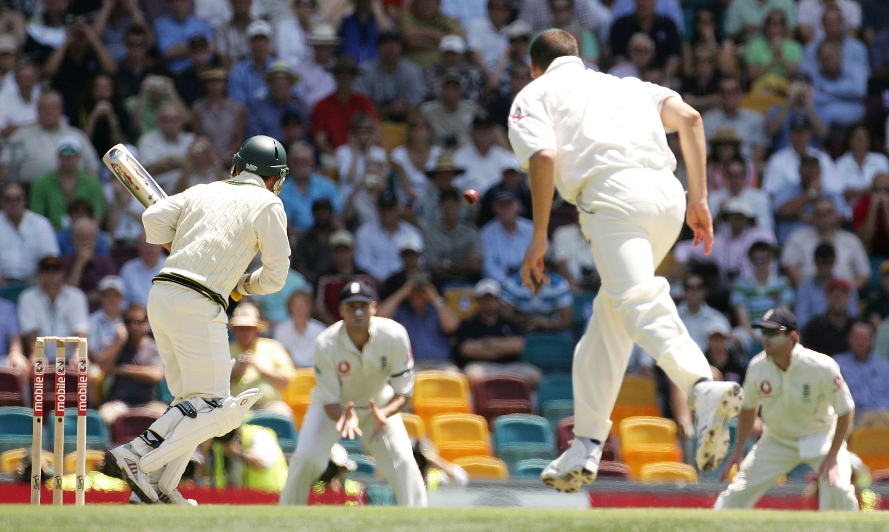 Steve Harmison and Justin Langer watch his delivery fly towards Freddie Flintoff at second slip