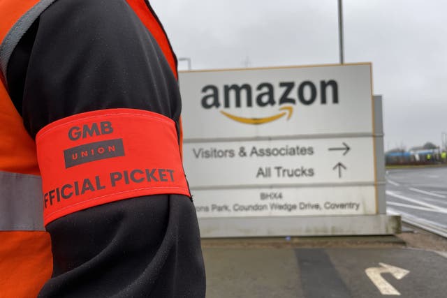 Workers at online giant Amazon have voted to continue their campaign of industrial action for another six months in a dispute over pay (Phil Barnett/PA)
