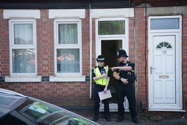 Police officers at an address on Ilkeston Road in Nottingham (Zac Goodwin/PA)