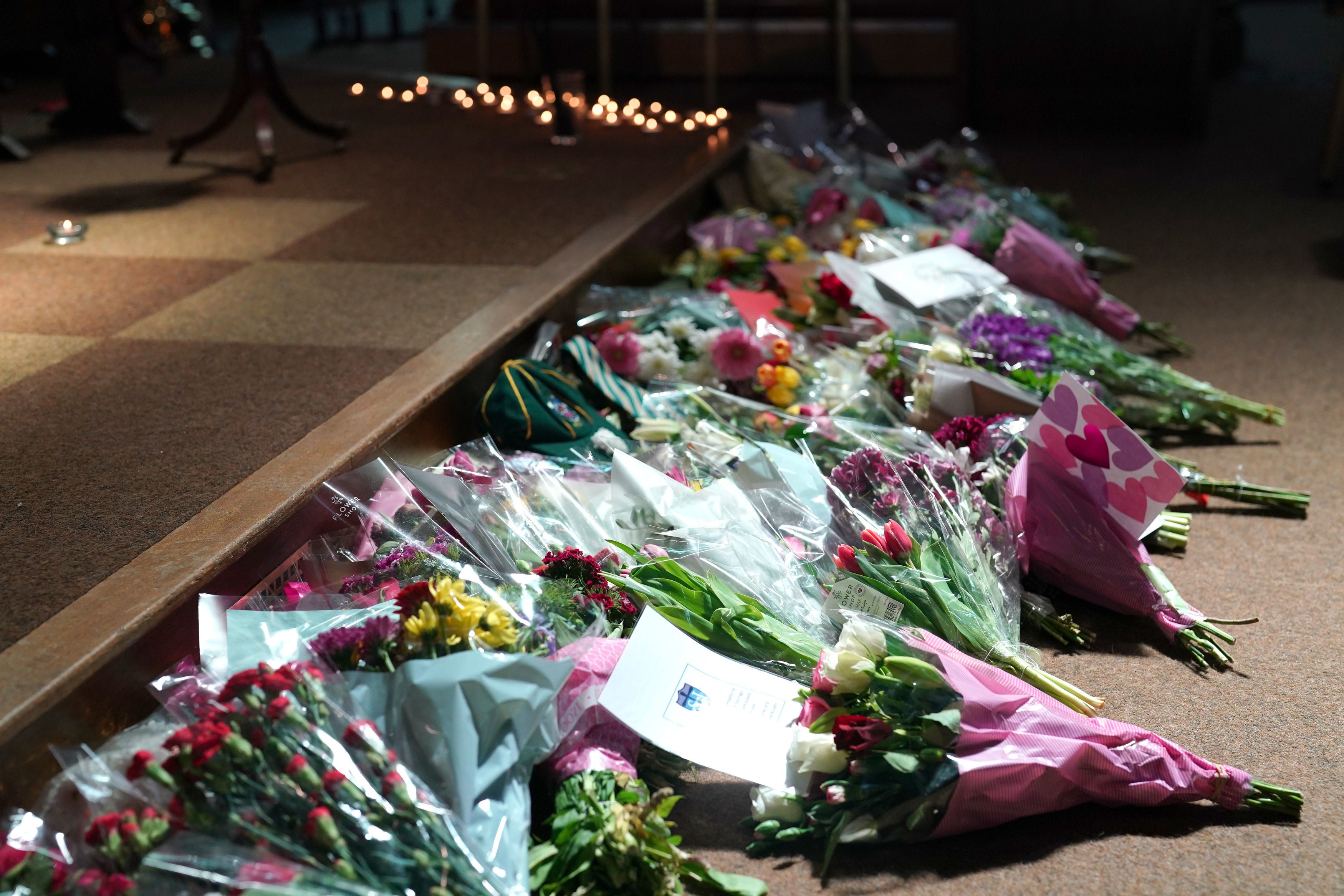 Flowers and candles in St Peter's church, Nottingham, paying tribute to the three victims of the attack