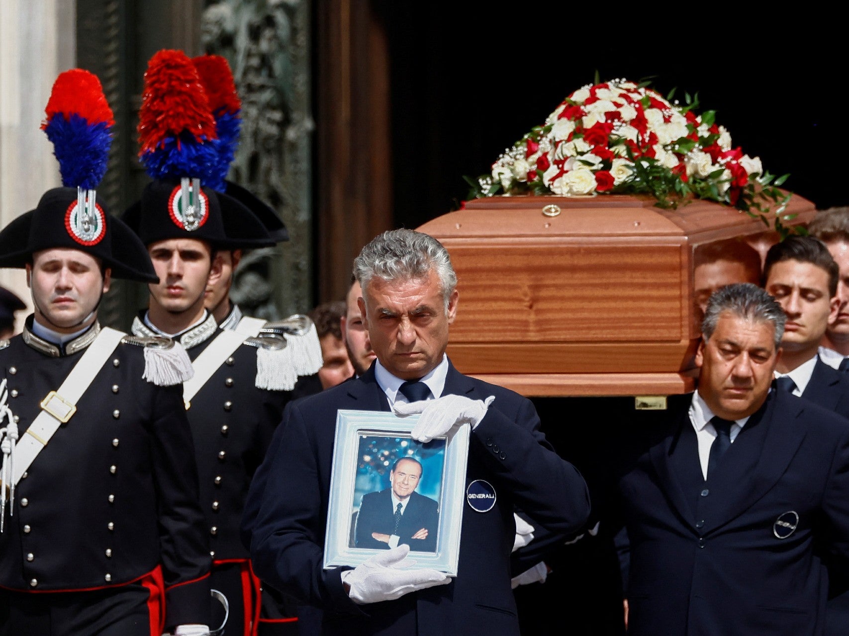 Pallbearers carry the coffin of Italian former prime minister Silvio Berlusconi