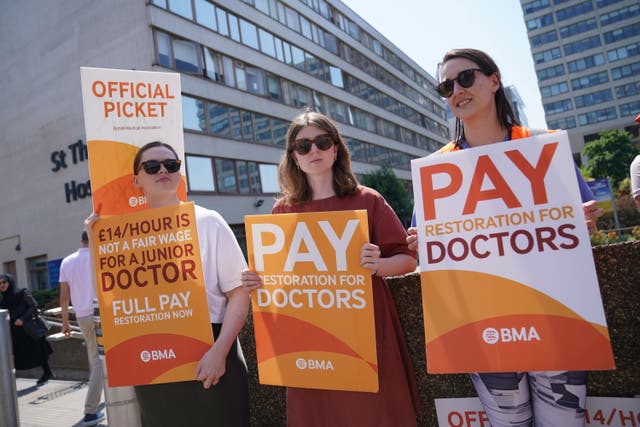 Striking junior doctors from the British Medical Association stand on the picket line outside St Thomas’ Hospital in London (Lucy North/PA)