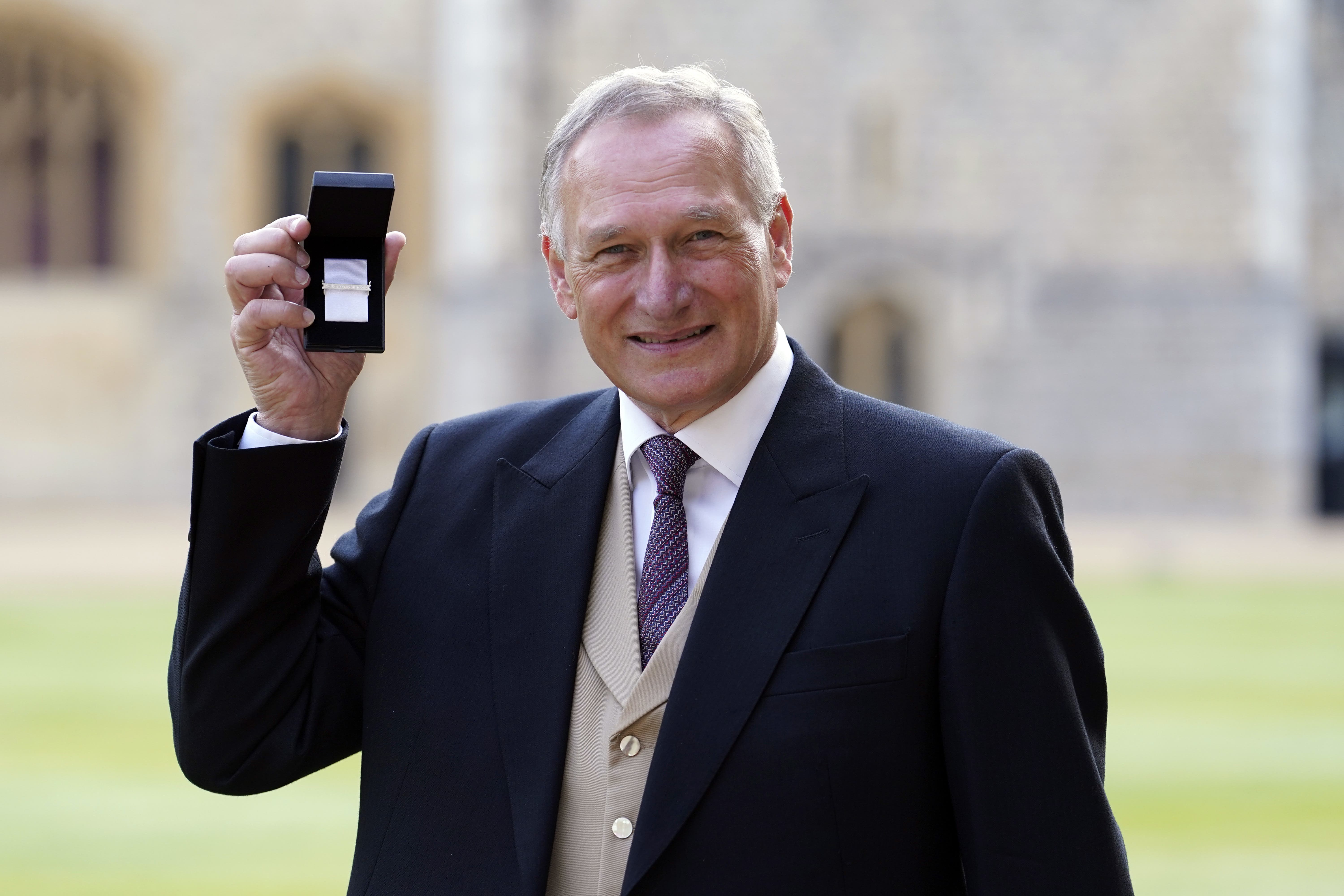 Sir David Hempleman-Adams shows off his medal (Andrew Matthews/PA)