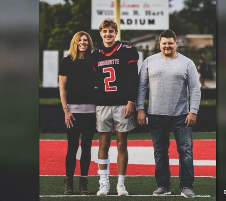 Jordan DeMay, centre, with his parents John DeMay and Jennifer Buta. The promising high school football player died after he was targeted in a sextortion plot.