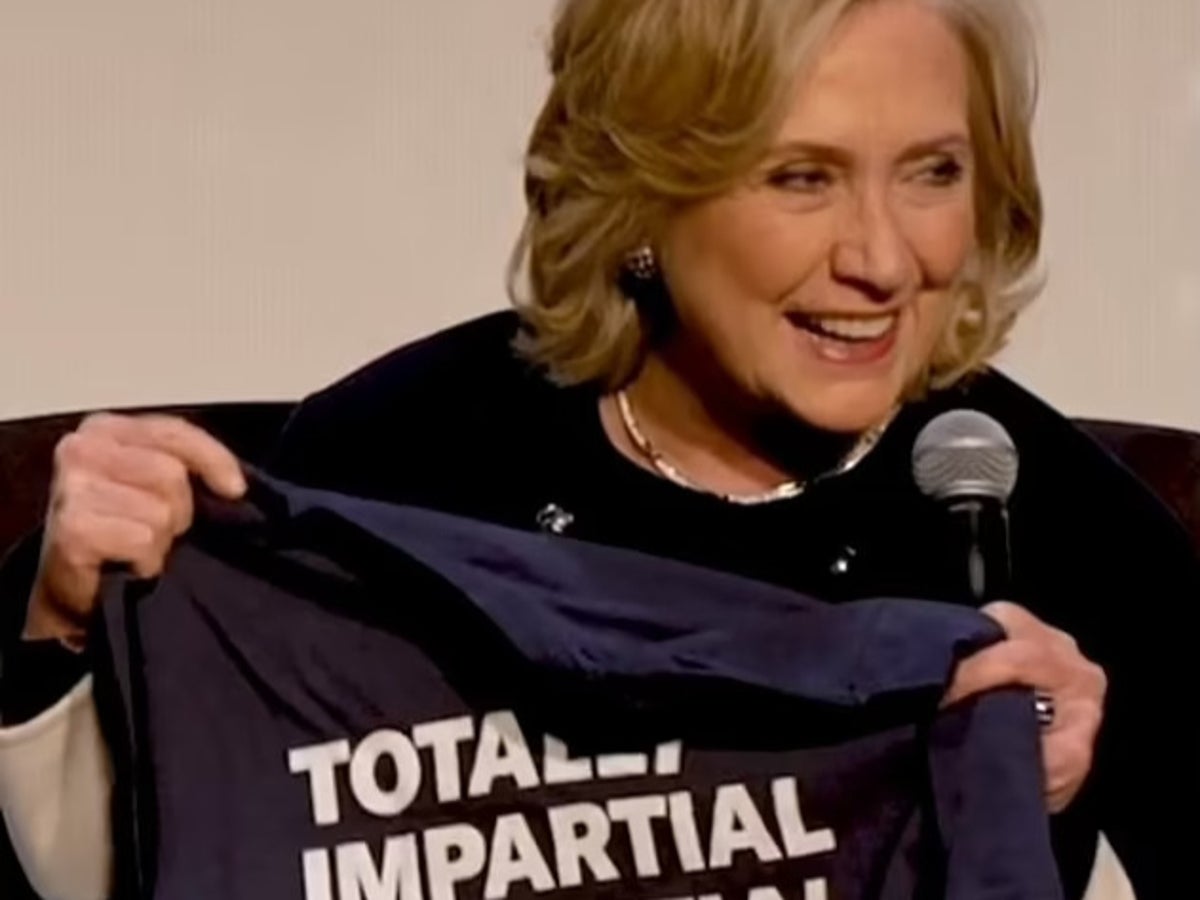 Clinton laughs at ‘impartial juror’ shirt as Trump claims she ‘acid-washed’ her emails