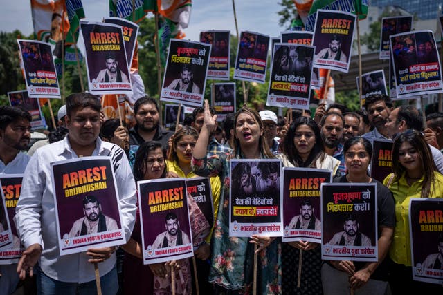 <p>File photo: Supporters of opposition Congress party hold placards during a protest rally against the wrestling federation chief over allegations of sexual harassment in New Delhi, India, 1 June 2023</p>