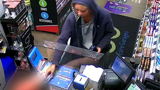 <p>In the CCTV footage released by Cheshire Police, Bilham is seen dressed in her disguise of a navy blue hoodie over her head, posing as the man George, while paying for something at a petrol station</p>