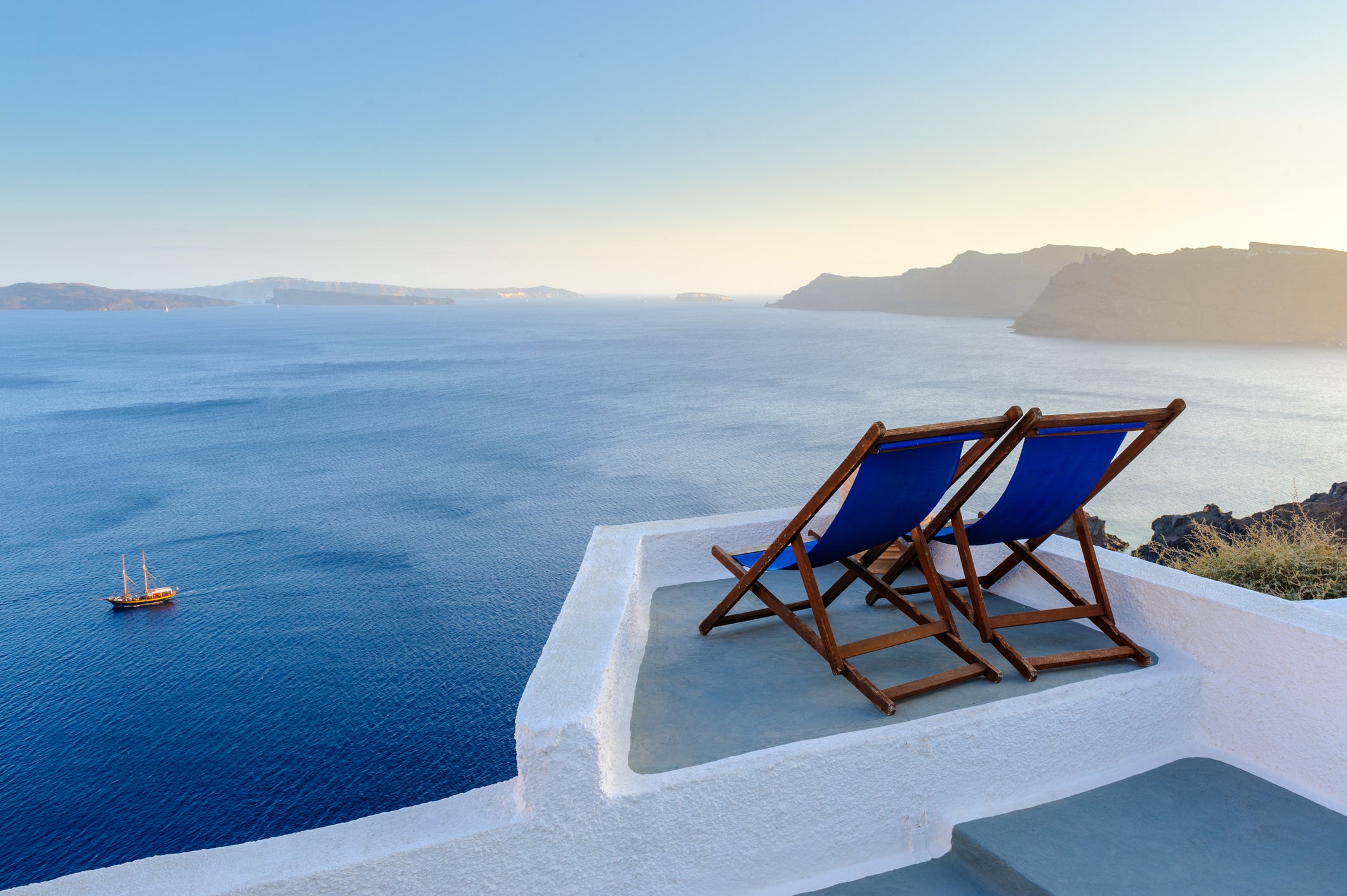 Take in Santorini’s spectacular sunsets with your significant other