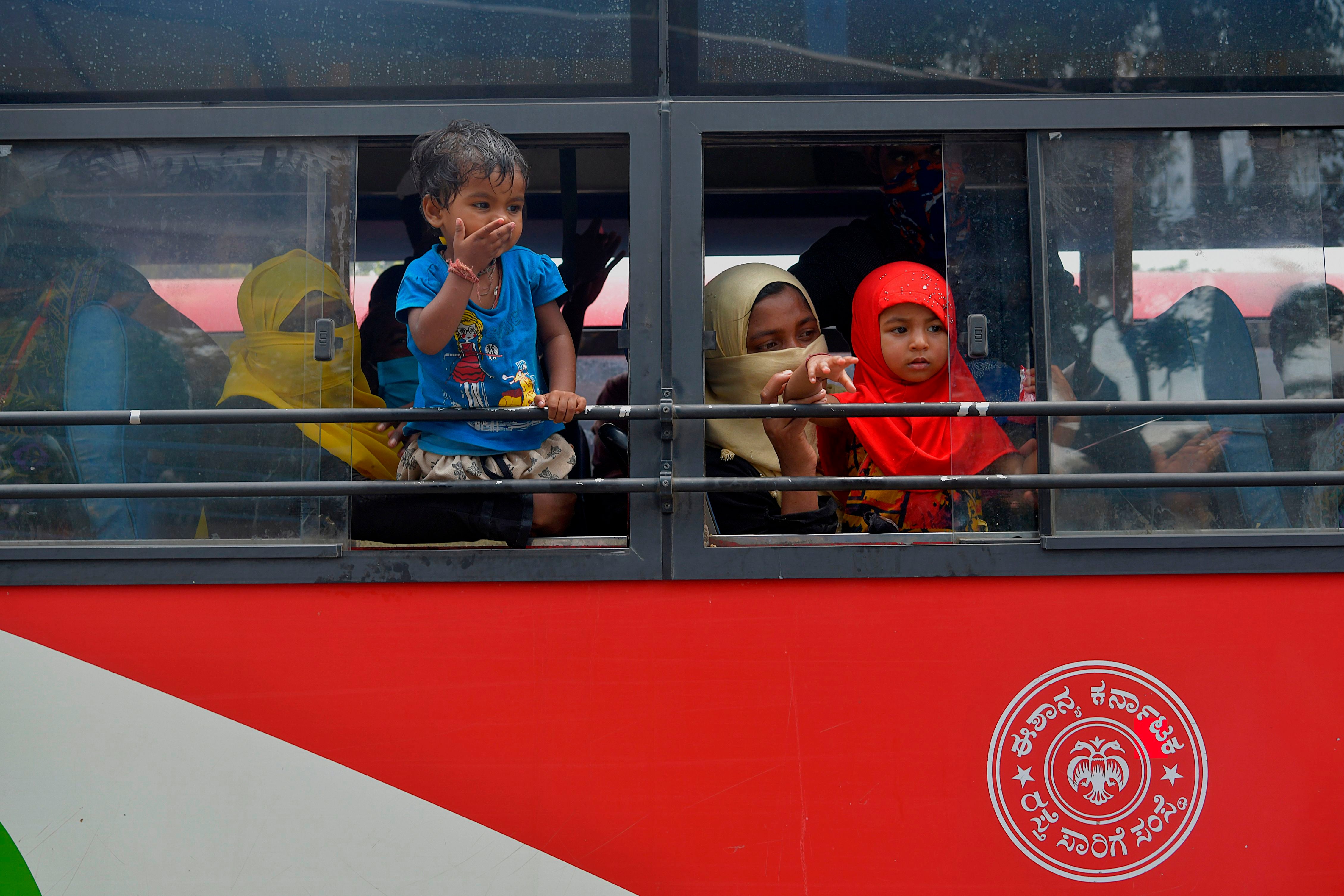 Passengers on board a state bus ferrying workers to their hometowns in Bengaluru