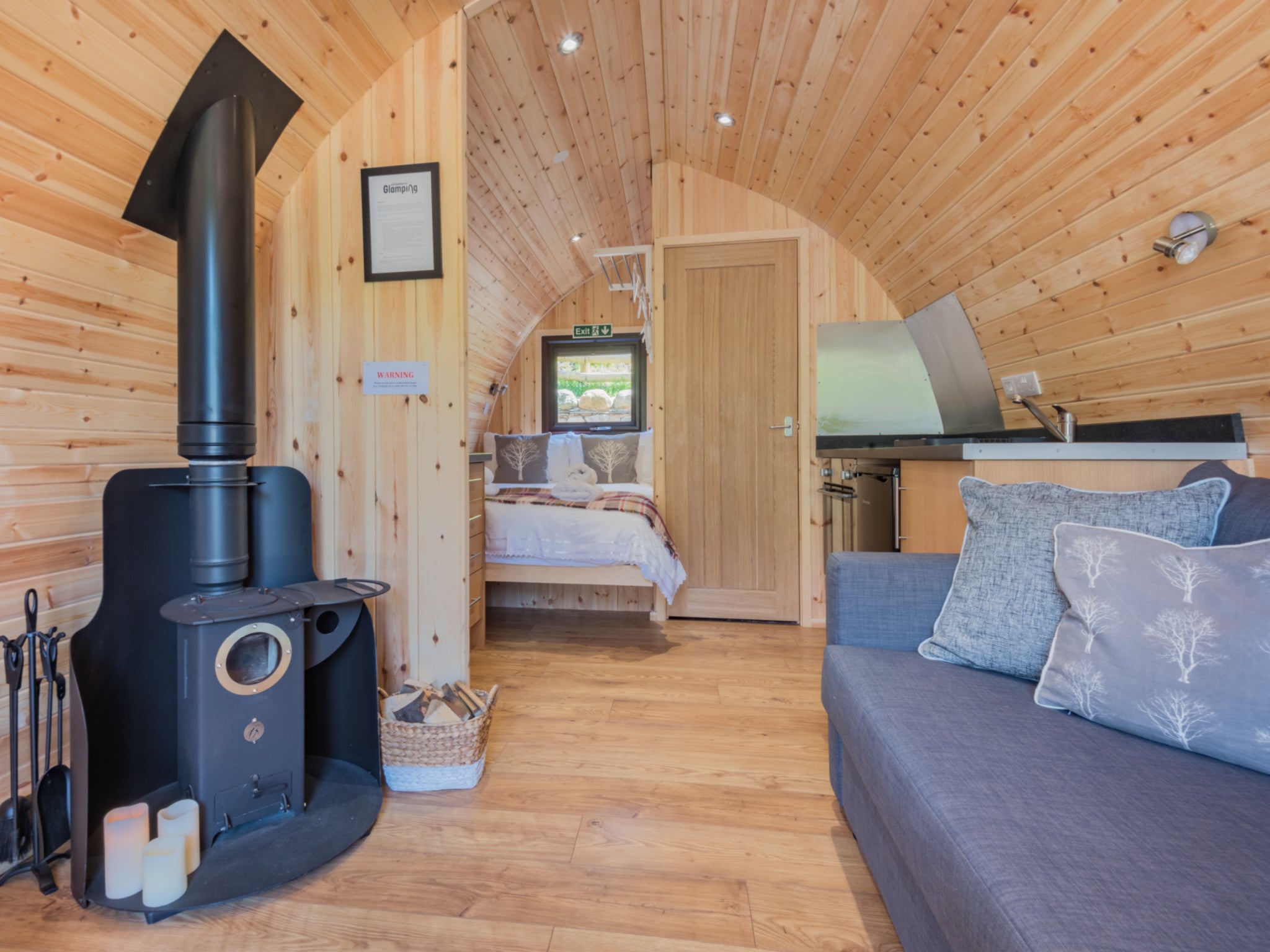 The pods feature wood-burning stoves, shower rooms and terraces