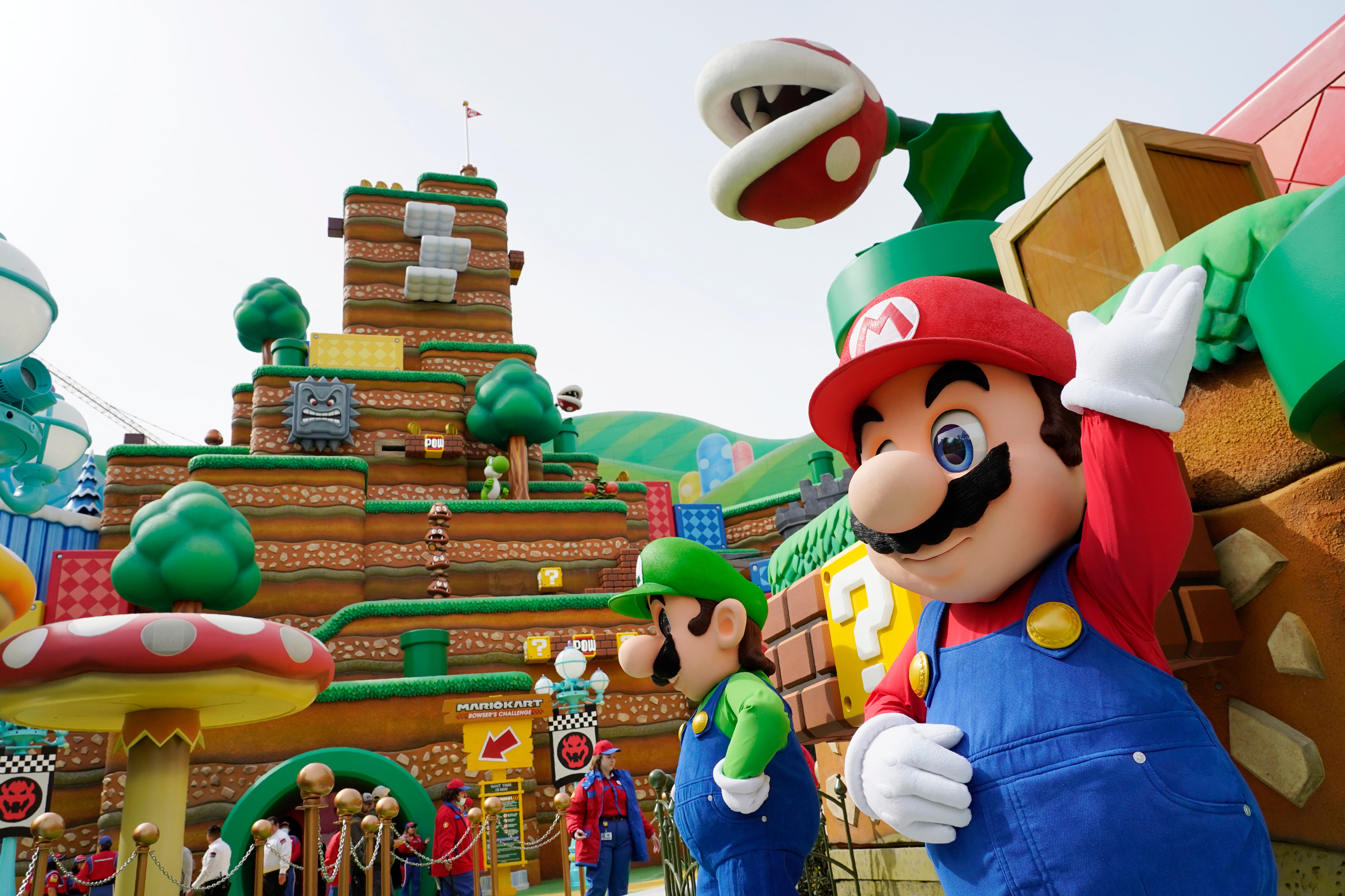 he Nintendo video game characters Mario and Luigi stand in the main plaza of the new Universal Studios in Orlando