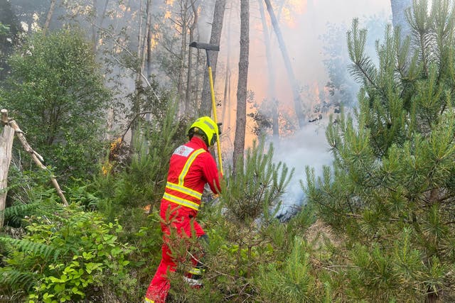 A wildfire has spread to an area in South Wales the size of almost 300 football pitches as firefighters continue to tackle multiple blazes across the region (SWFRS/PA)