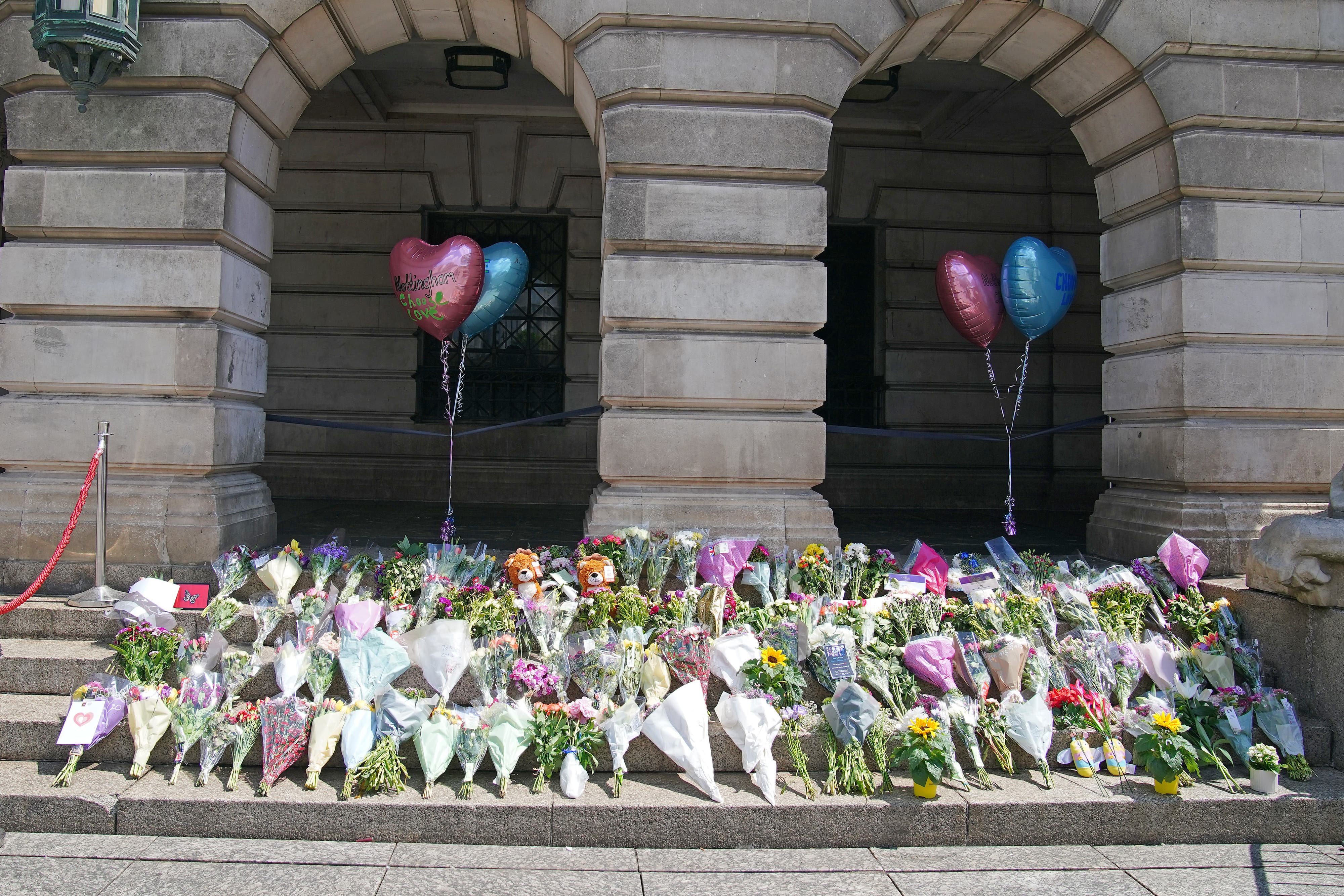 Flowers on the steps of Nottingham Council House after three people were killed and another three hurt in connected attacks on Tuesday morning. Picture date: Thursday June 15, 2023.