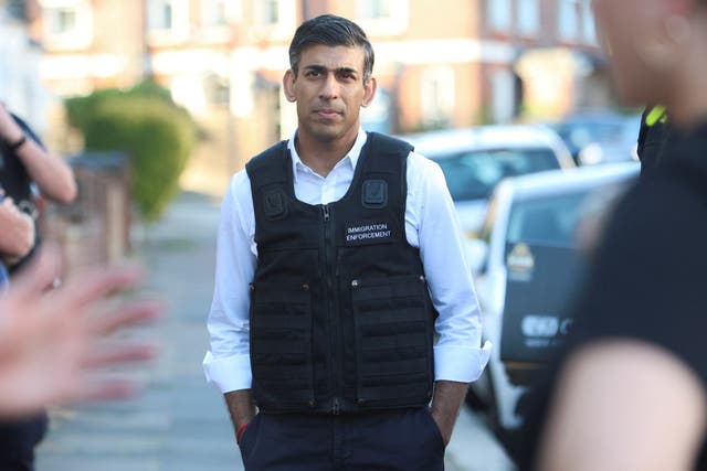 Rishi Sunak said it was good to see the immigration enforcement team’s work ‘first-hand’ (Susannah Ireland/PA)