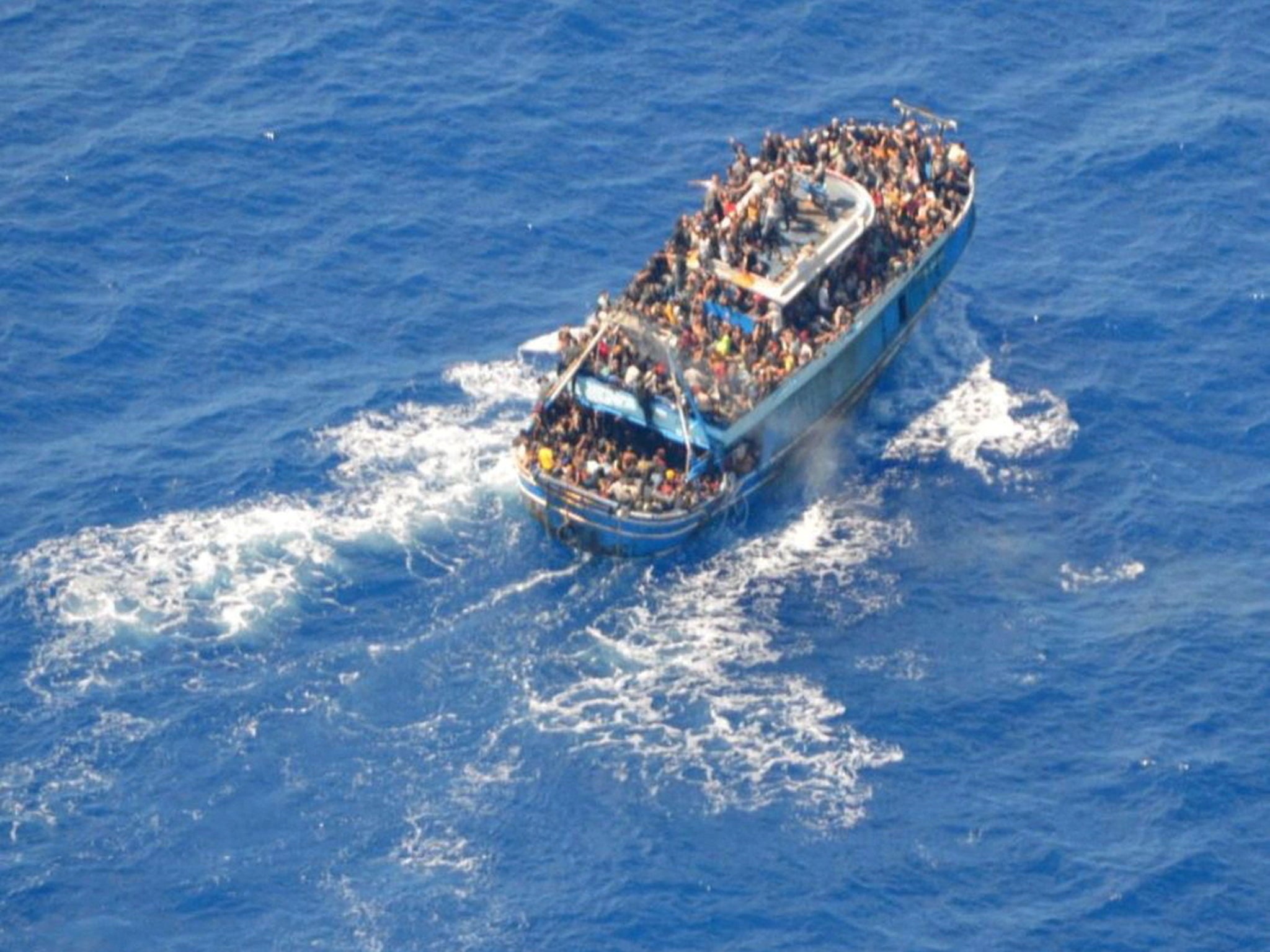 A photograph captured by the European Border and Coast Guard Agency (Frontex) shows a boat carrying hundreds of migrants shortly before it sank