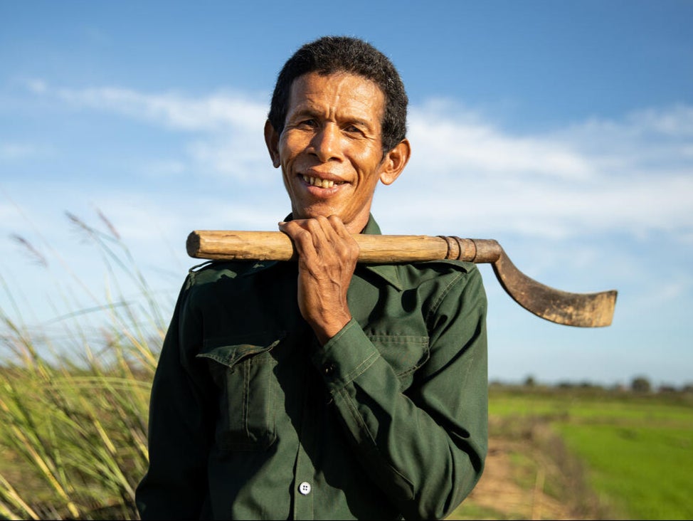 Deur Sok clears the area around his rice paddies in Sambour commune, near Kampong Thom. The canal built as part of WFP’s climate resilience work helps him keep his crops healthy