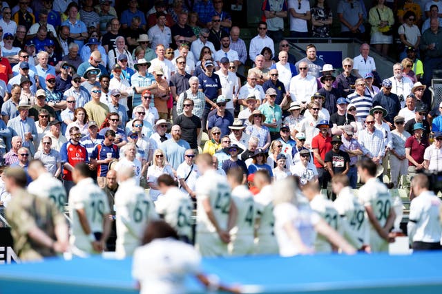 Cricket fans, along with England and Australia players observe a moments silence in memory of those killed in Nottingham on Tuesday (PA)