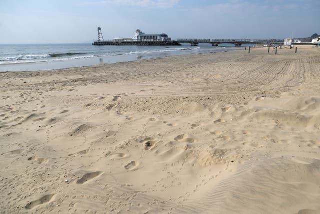 A 19-year-old man has appeared in court accused of raping a schoolgirl in the sea during a busy summer’s day at Bournemouth beach (PA)