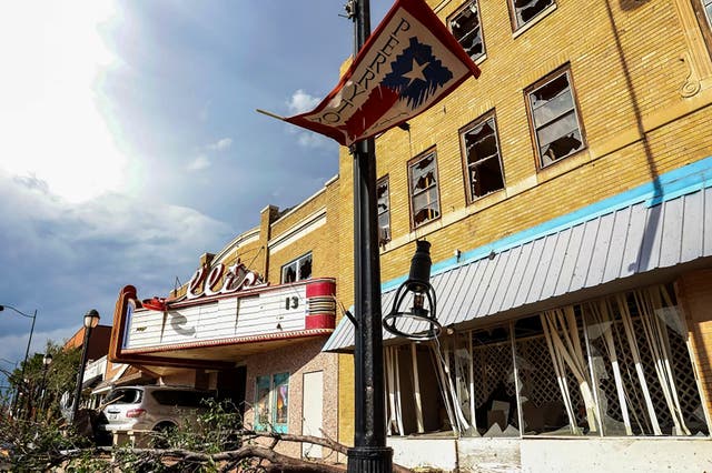 <p>A vehicle sits at the entrance to the Ellis Theater after a tornado struck Perryton, Texas, on June 15, 2023 </p>