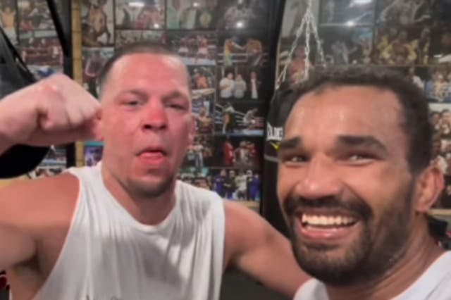<p>Esquiva Falcao (right) after a training session with Nate Diaz</p>