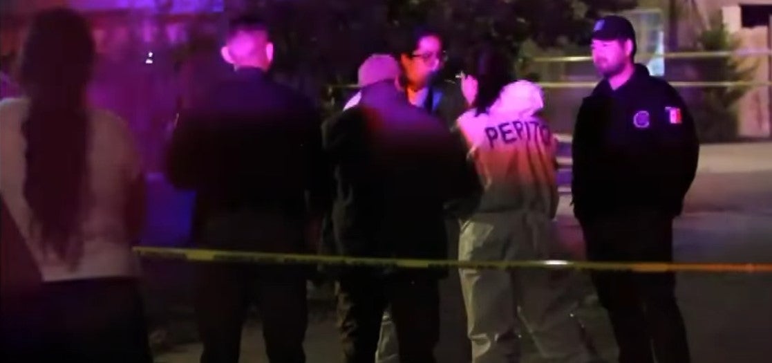 Investigators are pictured at the scene of the shooting in Tijuana