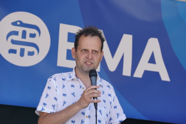 TV writer, author, and former doctor Adam Kay, speaks as striking junior doctors from the British Medical Association take part in a rally in Parliament Square (Lucy North/PA)