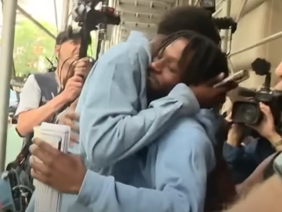 A family member hugs Jordan Williams, 20, following his released without bail after he fatally stabbed Devictor Ouedraogo, 36, who punched Mr Williams’ girlfriend and harassed riders on a New York City subway.