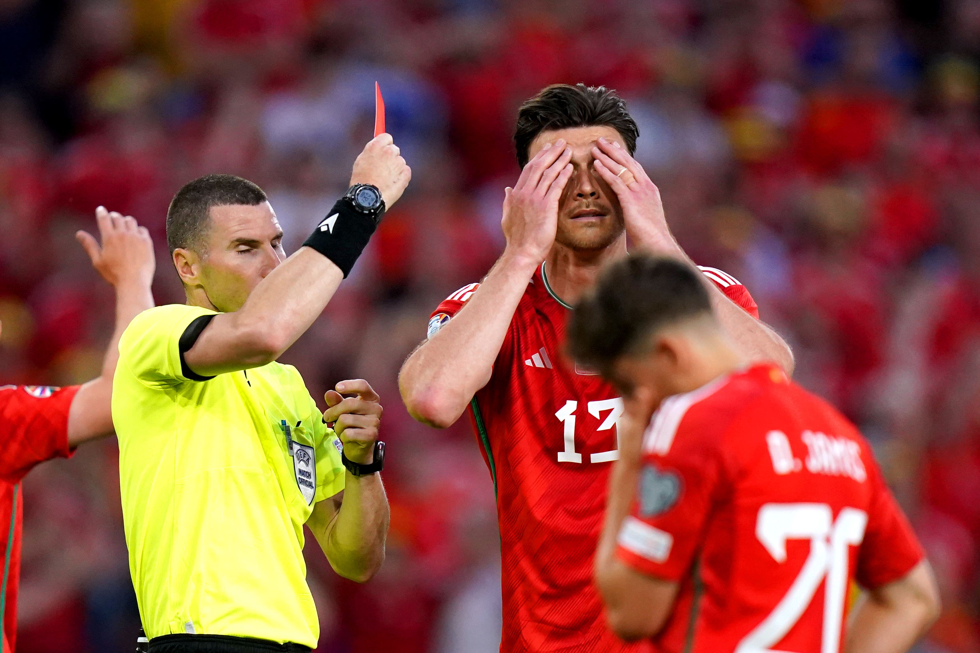Kieffer Moore was sent off as Wales slipped to a bad defeat
