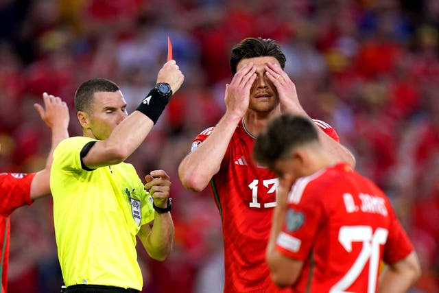 <p>Kieffer Moore was sent off as Wales slipped to a bad defeat </p>