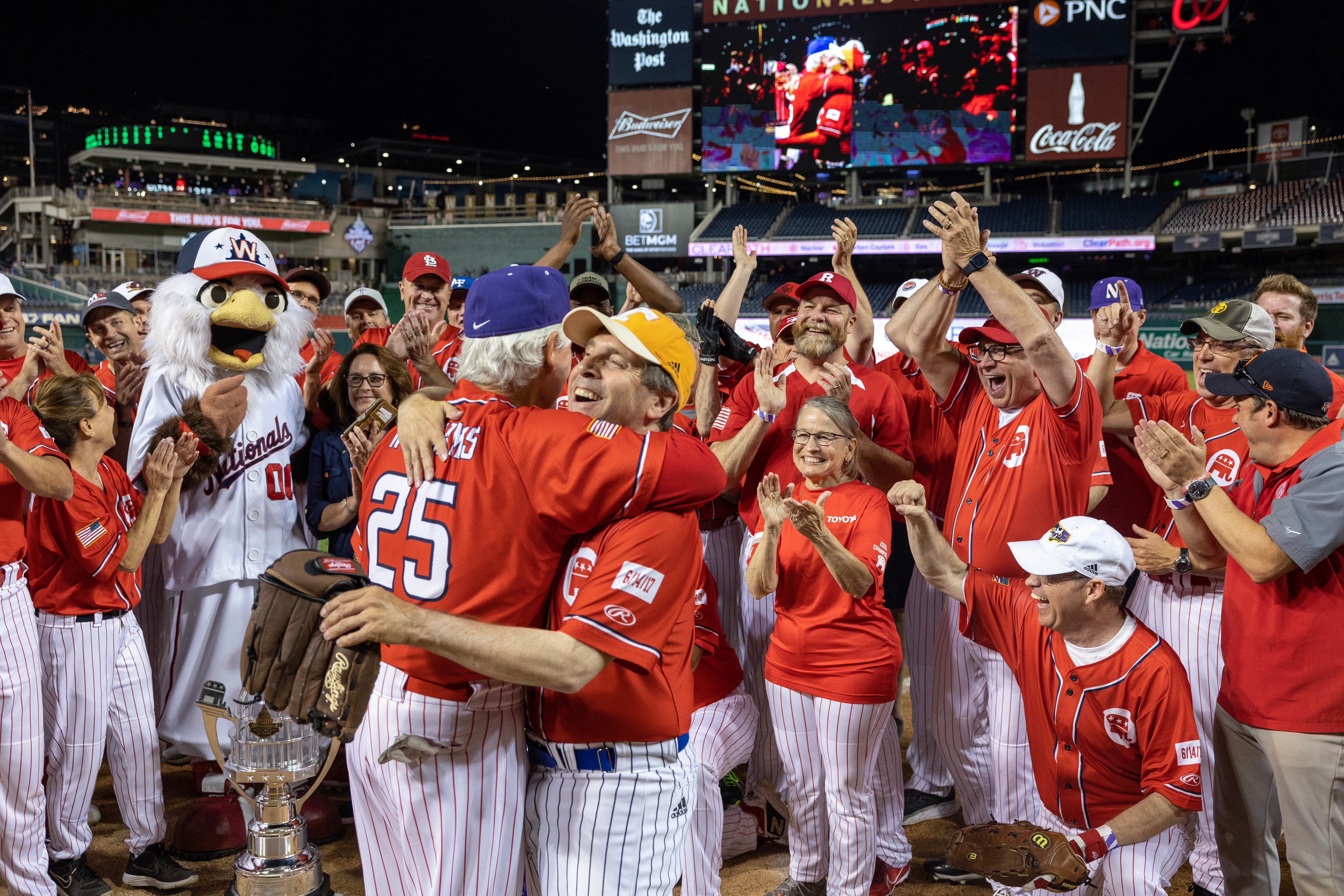 Republicans head coach Rep. Roger Williams (R-TX) celebrates with Chuck Fleischmann (R-TN) after wining the Congressional Baseball Game for Charity 16-6 against the Democrats at Nationals Park on June 14, 2023 in Washington, DC.