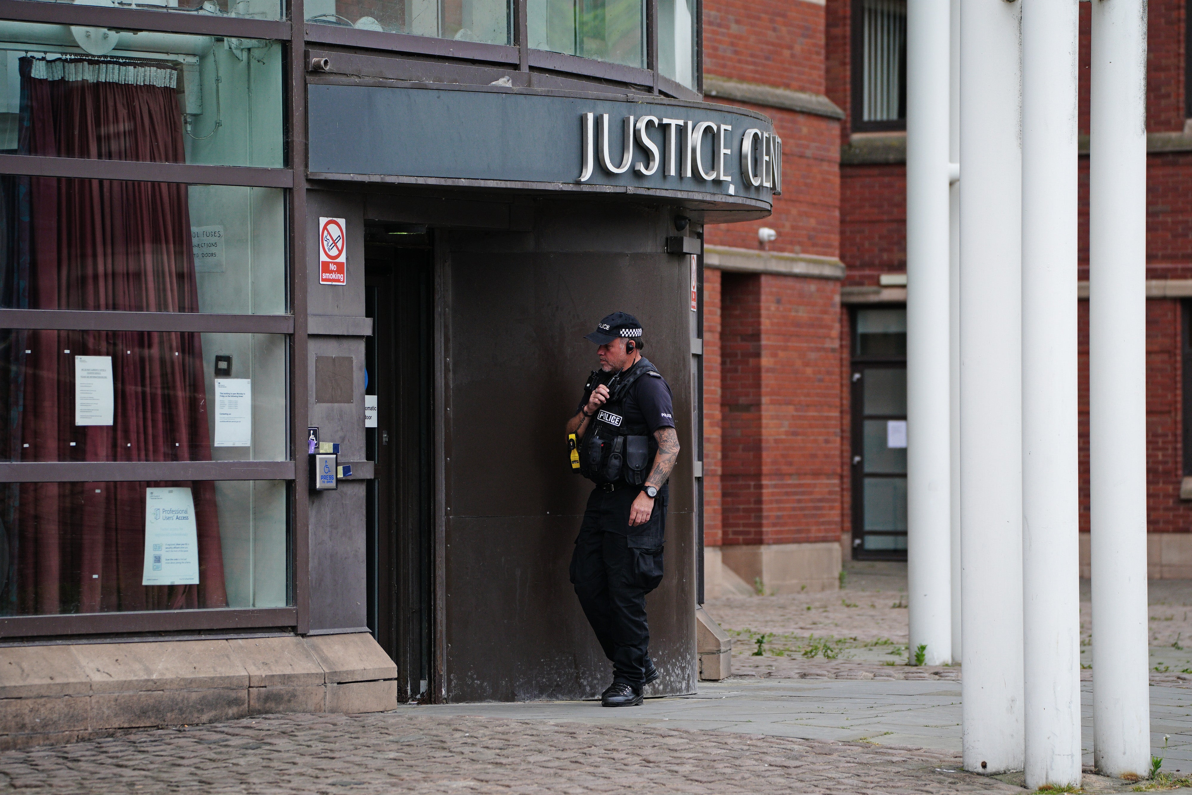 A police officer outside Nottingham Magistrates’ Court on Saturday as Valdo Calocane appeared inside