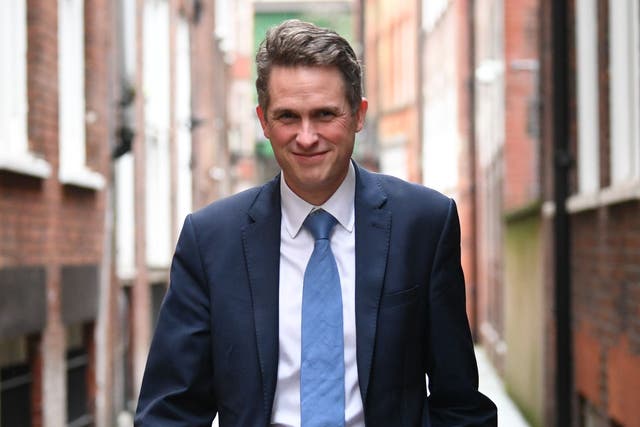 Sir Gavin Williamson was on the phone when he was approached (PA)