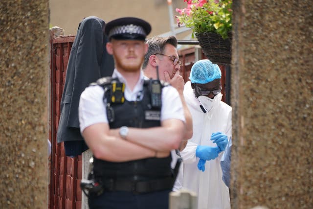 Police and forensic investigators at the scene in Hounslow (Lucy North/PA)