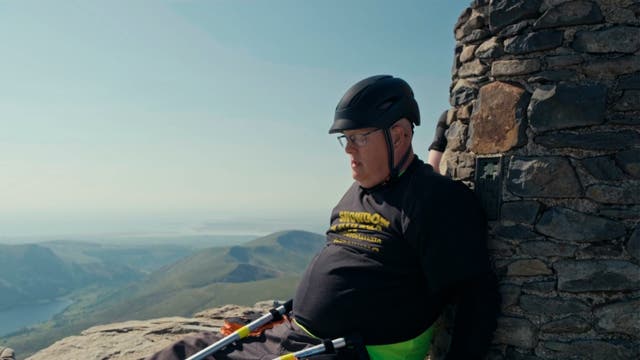 <p>Wheelchair user completes Mount Snowdon climb to raise awareness for condition</p>