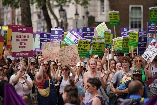 <p>Women's rights campaigners in Westminster, London after taking part in a march from the Royal Courts of Justice calling for decriminalisation of abortion</p>
