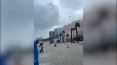 Waterspout crashes onto Florida beach sending debris flying