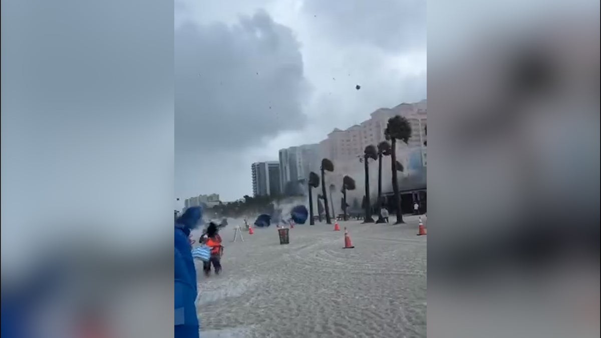 Waterspout crashes onto Florida beach sending debris flying 