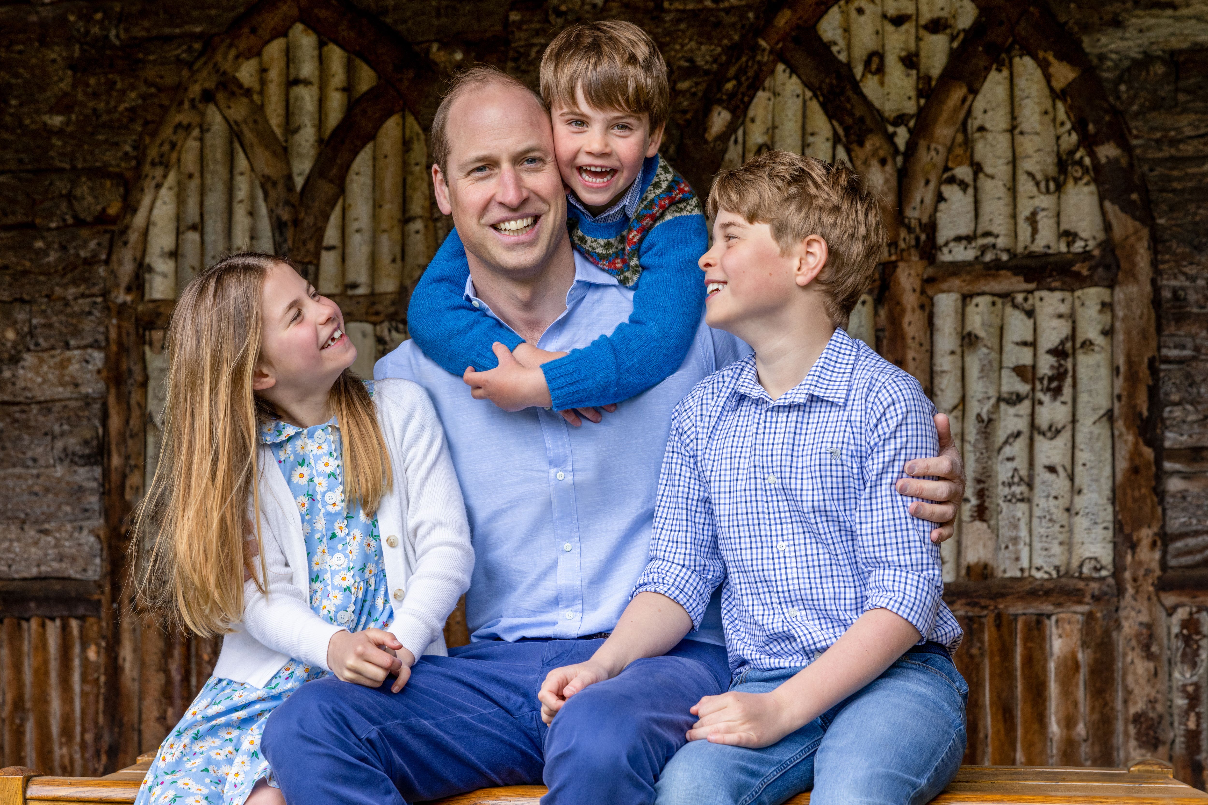 The Prince of Wales is pictured with prince George and Louis and Princess Charlotte