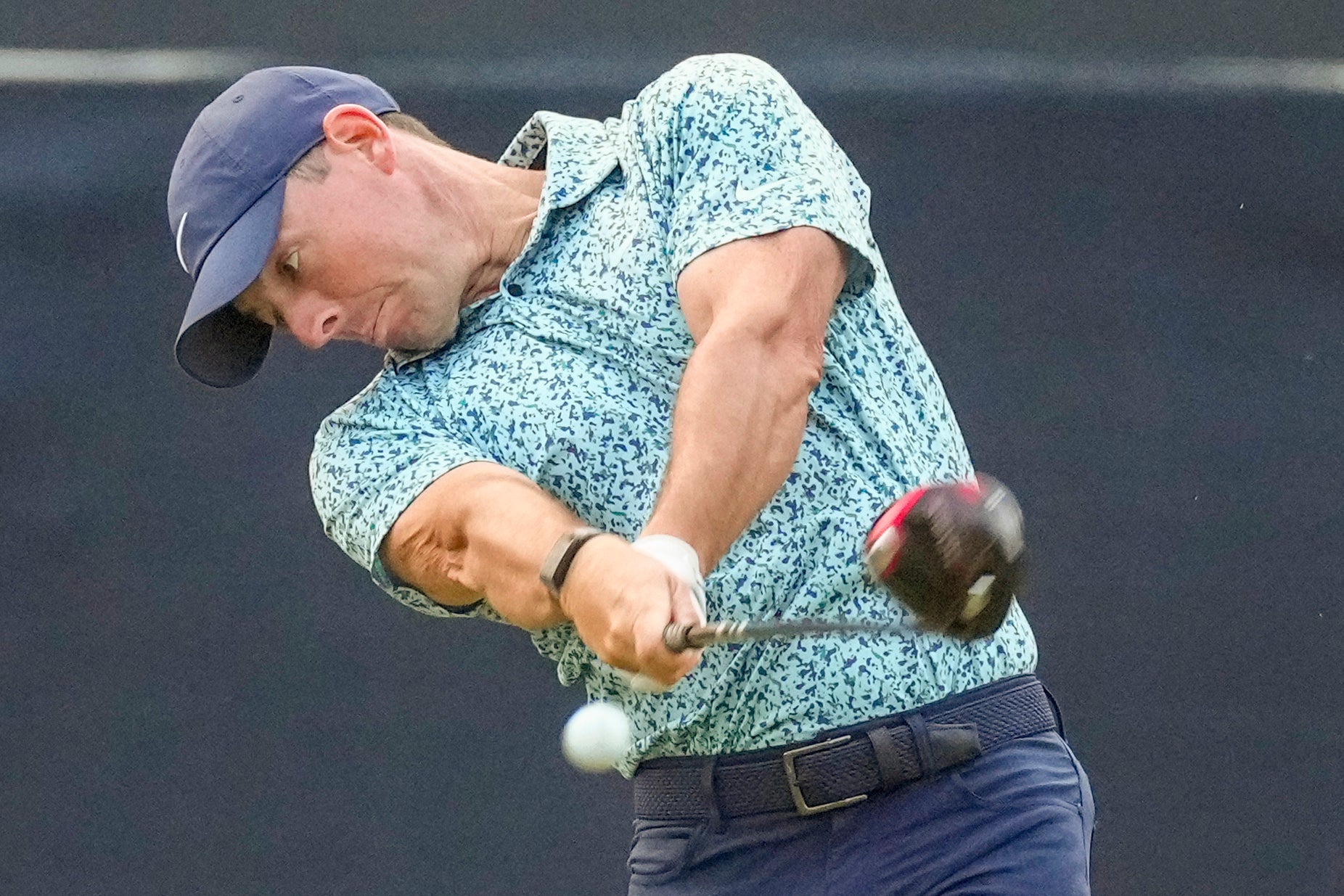 McIlroy hits his tee shot on the par-four 17th hole