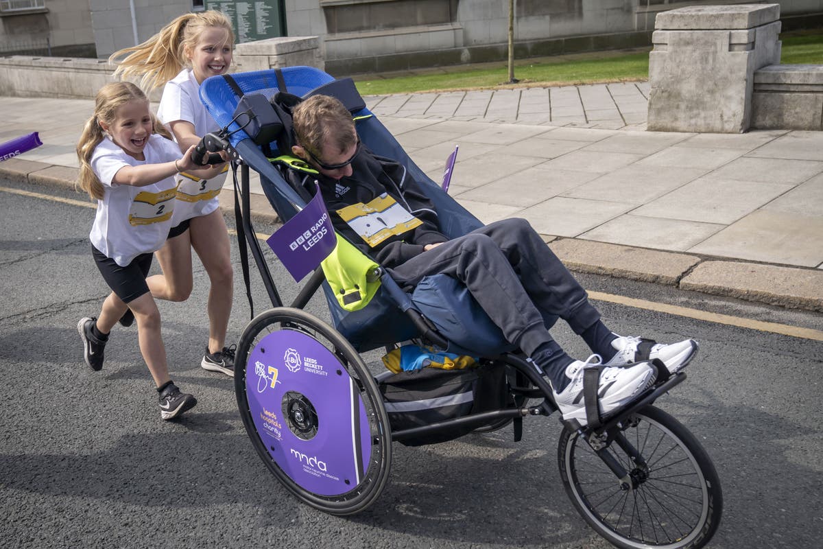 Rob Burrow pushed around Leeds fun run course by daughters on Father&rsquo;s Day