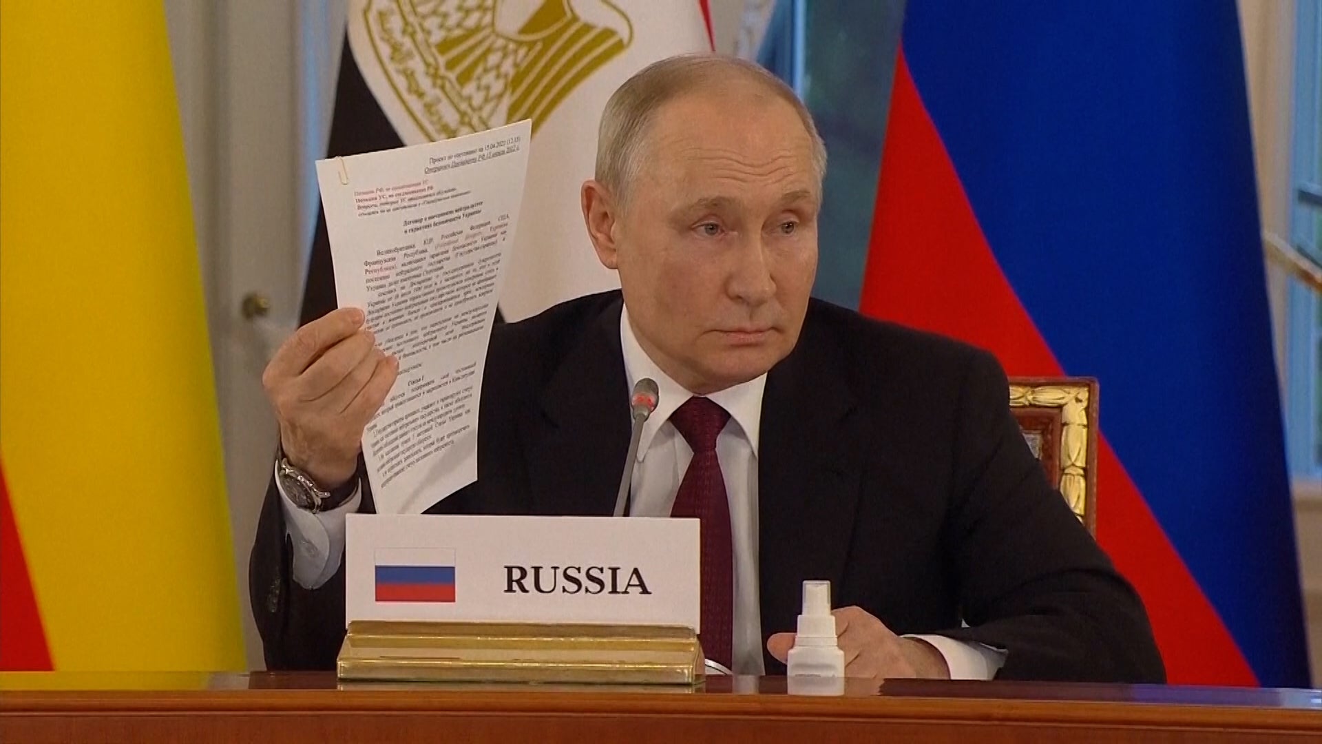 <p>Putin shows show off what he claims is 'draft peace agreement' with Ukraine - that they 'refused to sign'</p>