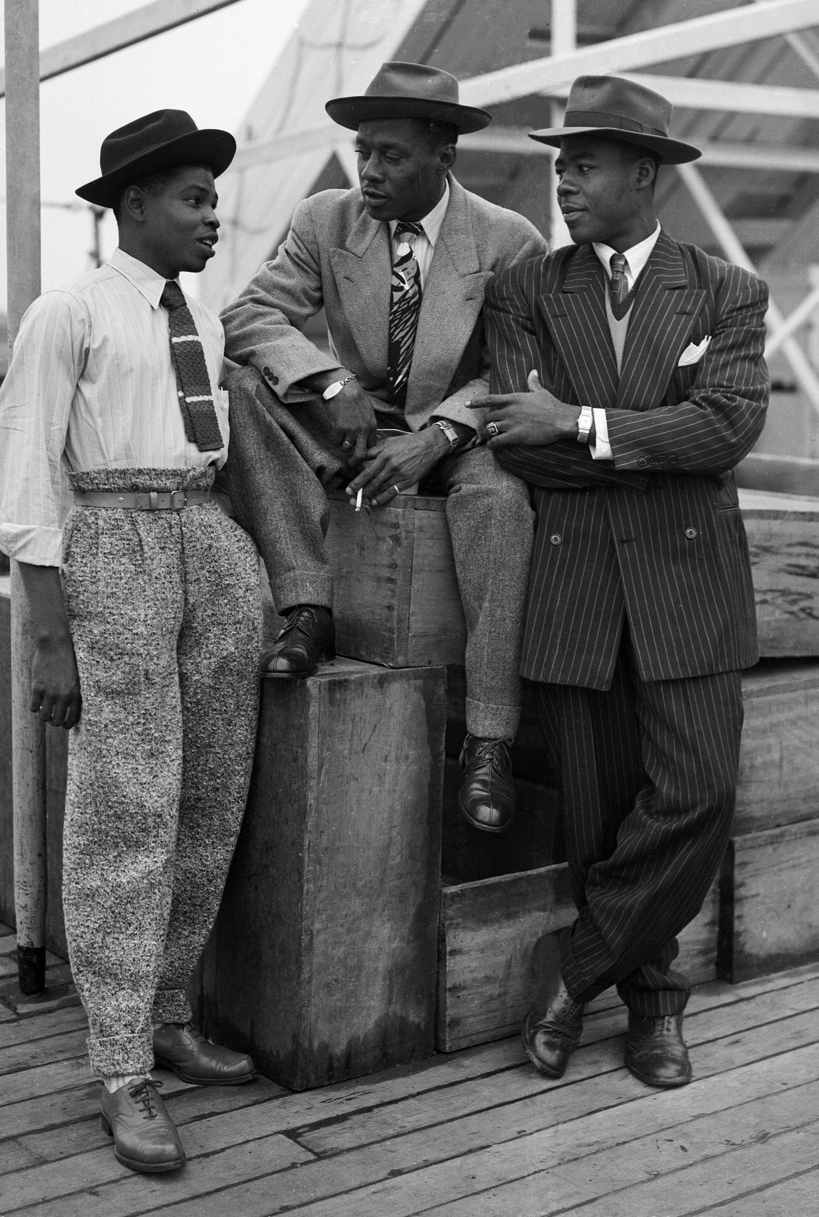 Left to right: John Hazel, a 21-year-old boxer, Harold Wilmot, 32, and John Richards, a 22-year-old carpenter, arriving at Tilbury