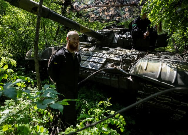 <p>Ukrainian soldiers prepare for battle on Sunday near Donetsk</p>