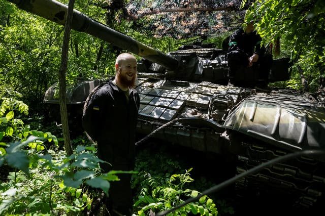 <p>Ukrainian soldiers prepare for battle on Sunday near Donetsk</p>